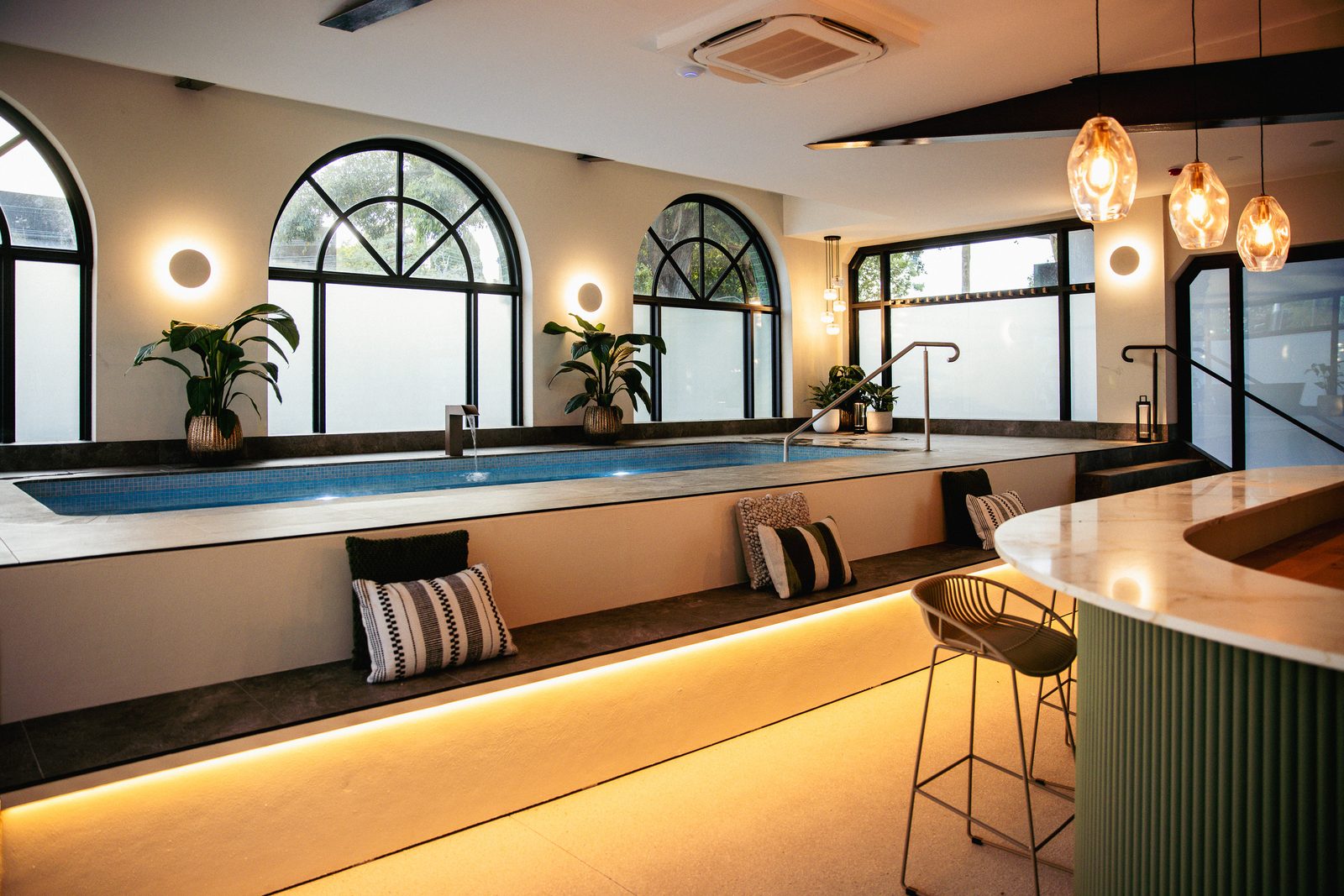 The Bathhouse: pool room with arched windows